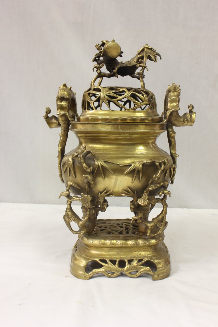 bronze/brass incense burner: A fine bronze/brass incense burner decorated with tree trunks and flowers, 16"Hx10.7"x8.5"