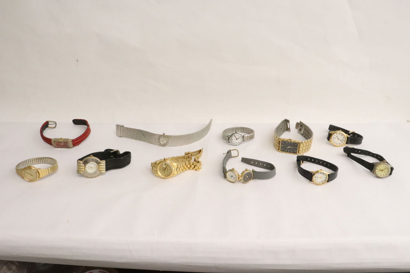 10 wrist watches, the Rolex is a reproduction (1 of 10)