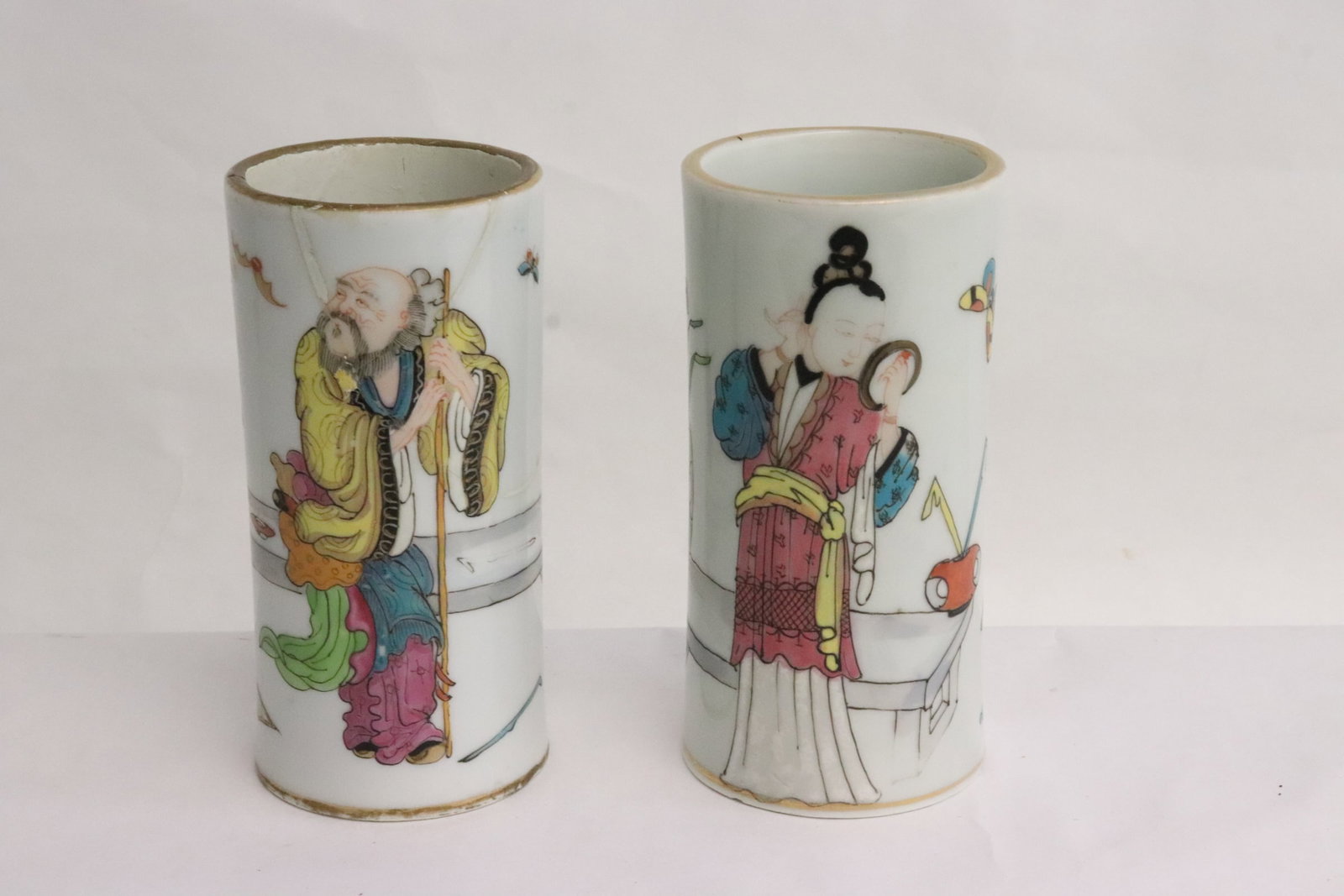 Pair Chinese famille rose porcelain brush holders: Pair Chinese famille rose porcelain brush holders, one base chip and one has repair, 4.78"x2.35"dia ea