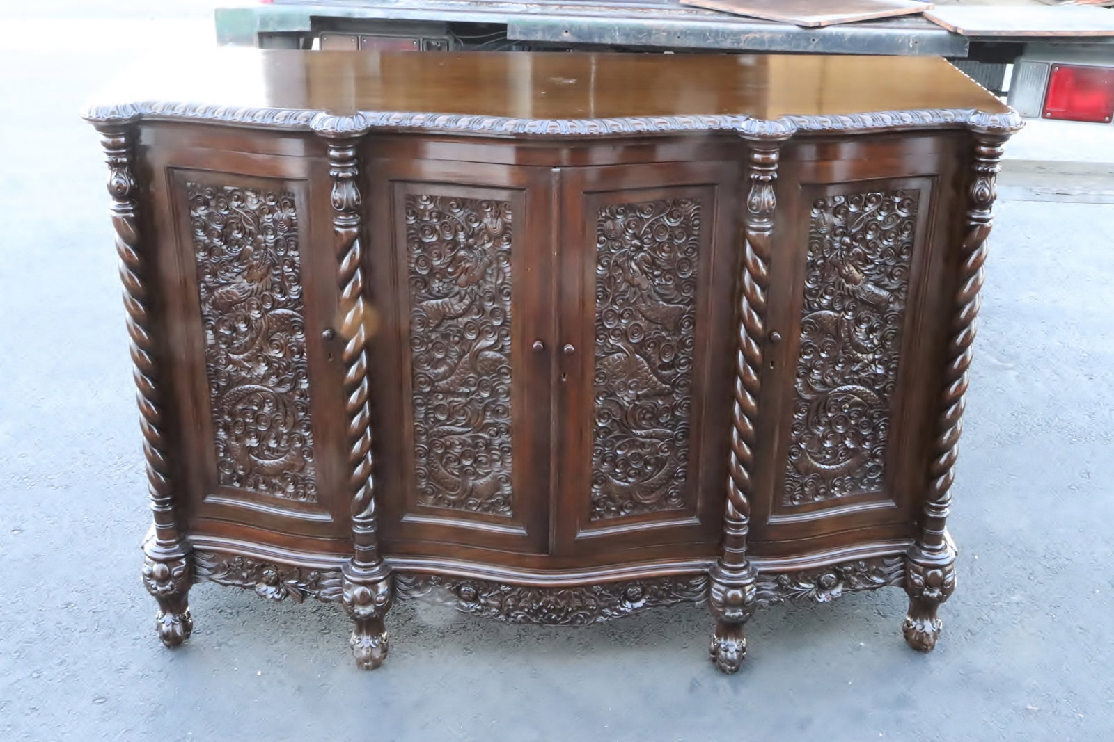 Antique Chinese rosewood cabinet: Antique Chinese rosewood cabinet with dragon motif in relief, 40.15"x60.6"x22.8"