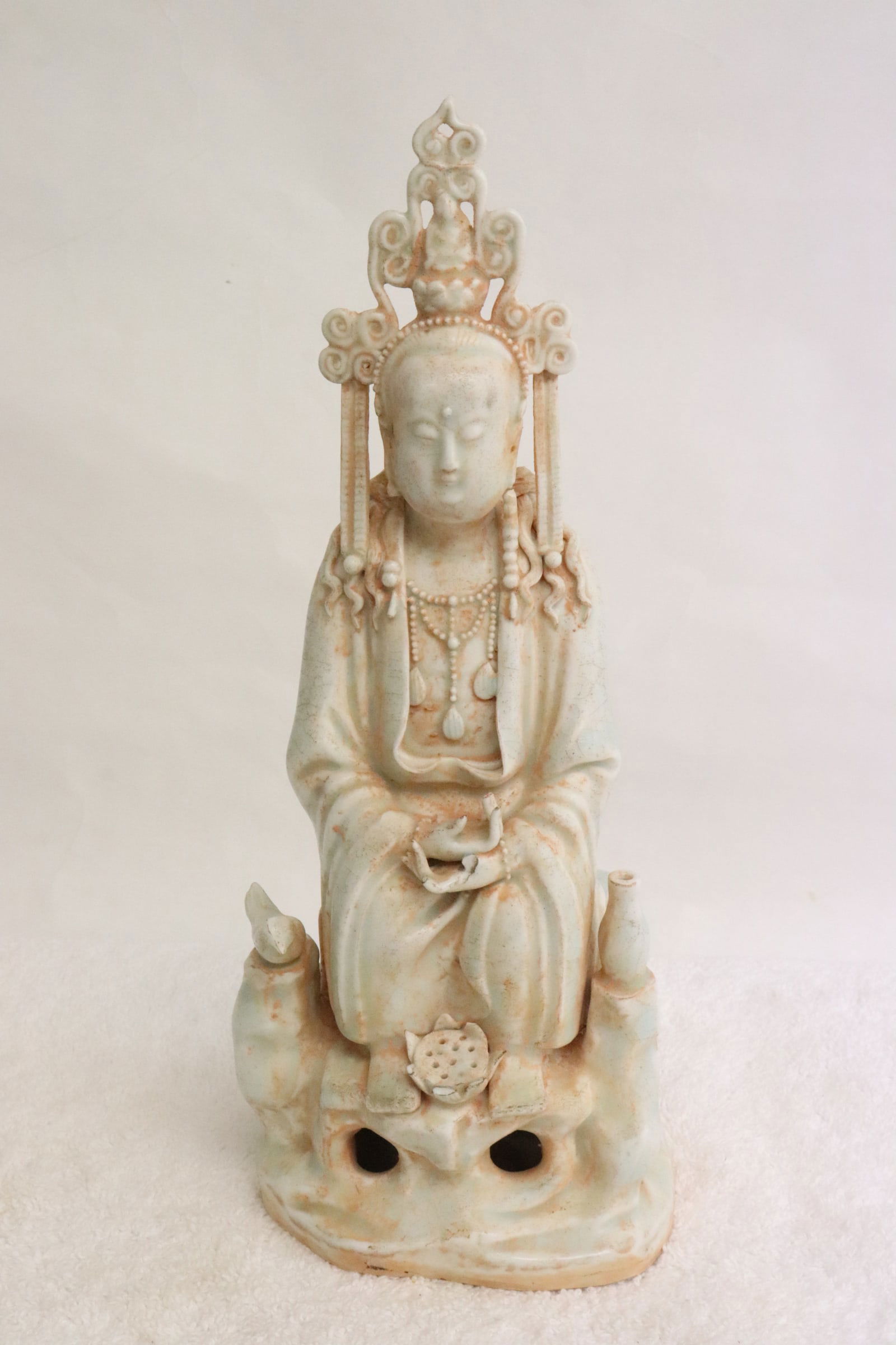A celadon porcelain sculpture of deity: A celadon porcelain sculpture of deity, 9.75"H