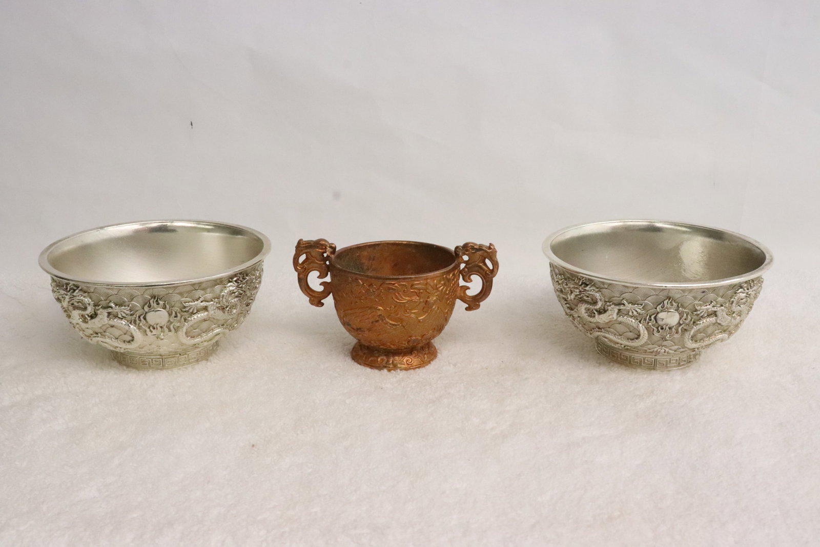 2 white bronze bowls, and a gilt bronze wine cup: 2 white bronze bowls (2.25"x4.6"dia ea), and a gilt bronze wine cup (2.5"x4.2"x2.6")