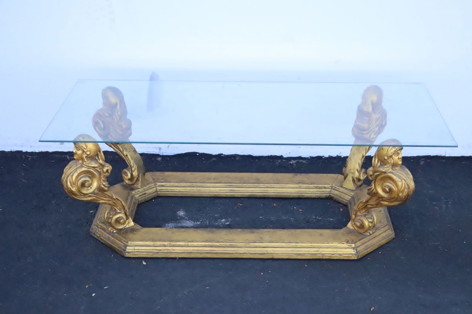 Glass top gilt wood coffee table w/ figural motif legs: Glass top gilt wood coffee table with figural motif legs, 15.2"x46"x20"