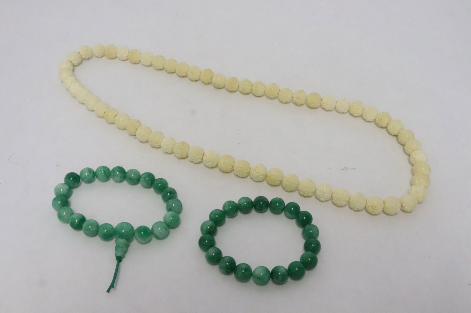 a bone style bead necklace, & 2 jadeite like bead bracelets: Chinese bone style bead (0.48"x0.48"dia ea) necklace, and 2 jadeite like bead (0.37"x0.37"dia ea) bracelets
