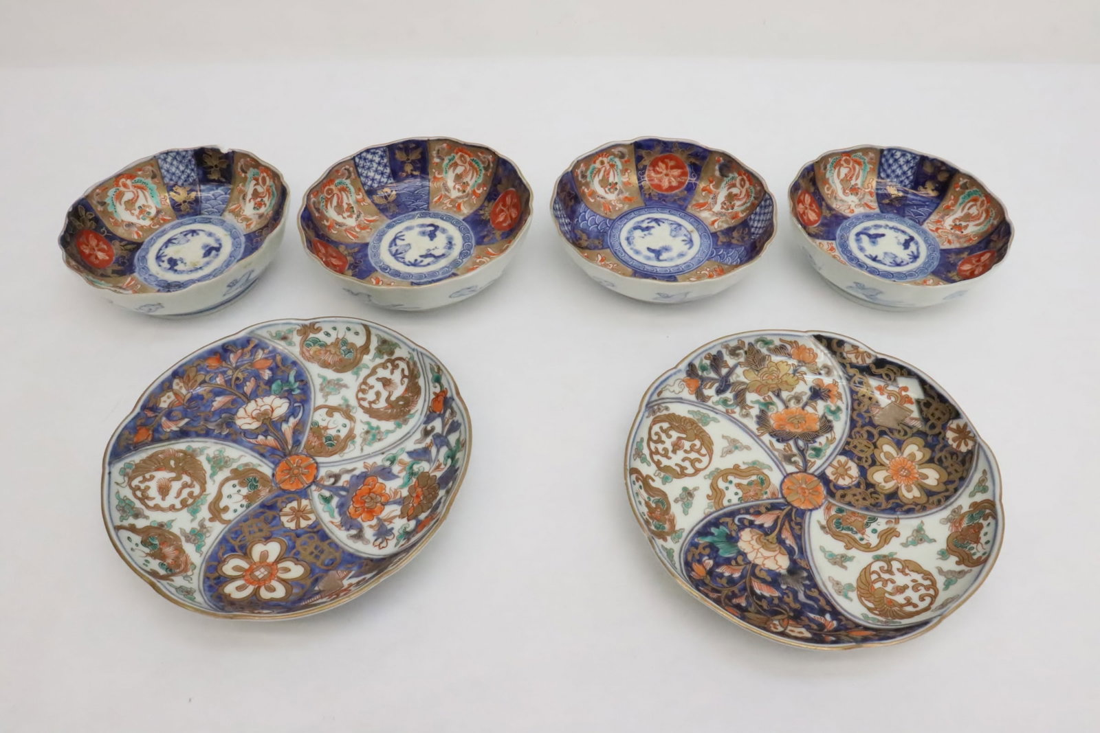 6 antique imari porcelain: 6 antique imari porcelain; 2 plates (1.25"x7.75"dia ea), and 4 bowls (one bowl top rim chip) (1.95"x5.9"dia ea)