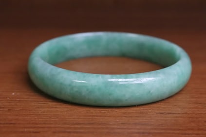 An apple green jadeite bangle
