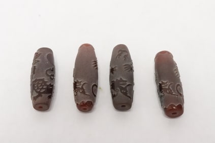 4 Chinese vintage carved Peking glass beads