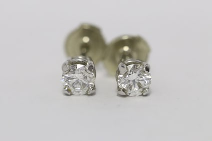 Pair 14K W/G diamond earrings