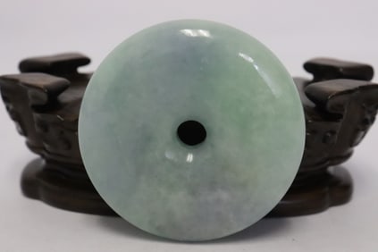 A large and heavy jadeite disc