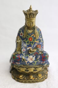 A very heavy enamel on bronze sculpture of deity