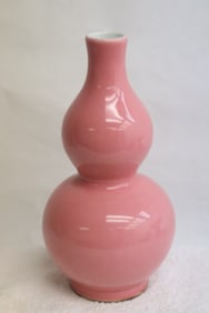 A pink glazed porcelain gourd shape vase