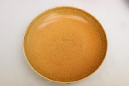 Yellow glazed porcelain plate
