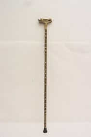 A bronze cane with dragon motif finial