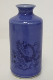 A small blue glazed porcelain bottle