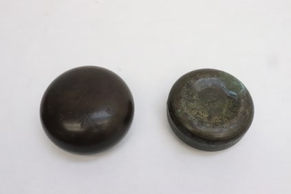 2 bronze round boxes