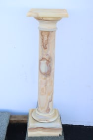 An onyx pedestal stool
