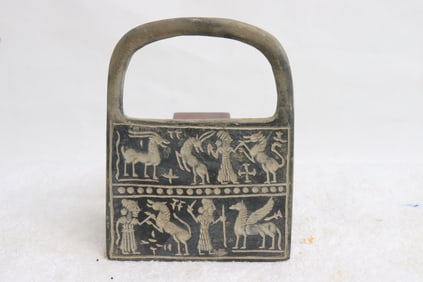 An Aztec(?) earthenware handled plaque