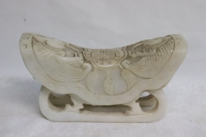 White stone carved pillow