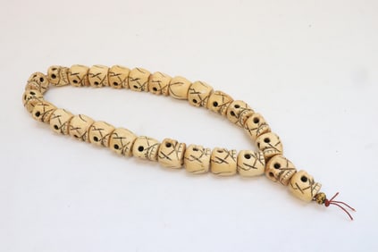 A bone carved bead necklace