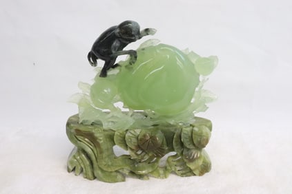 Serpentine carving with green stone base