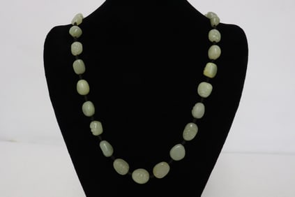 A celadon jade bead necklace, no clasp