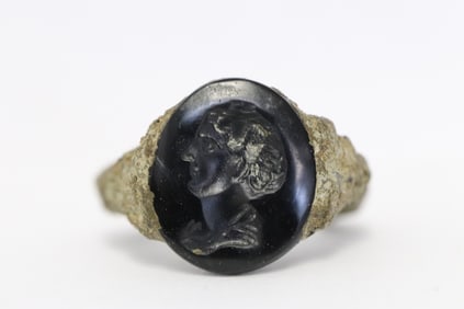 metal ring with carved intaglio on top