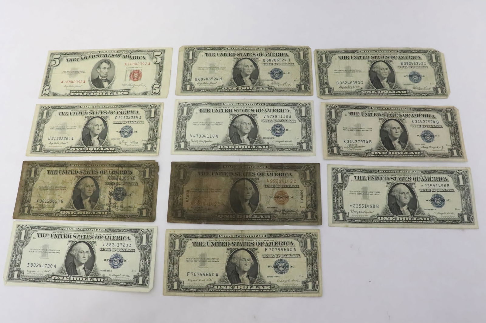 11 US notes; 1953 5-dollar, and ten 1-dollar notes (1 of 11)