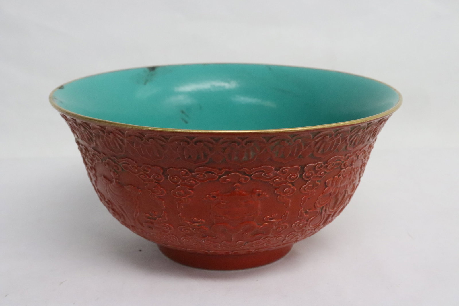 Chinese red glazed and carved porcelain bowl: Chinese red glazed and carved porcelain bowl, 3"x6.17"dia