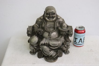 A large white metal sculpture of deity