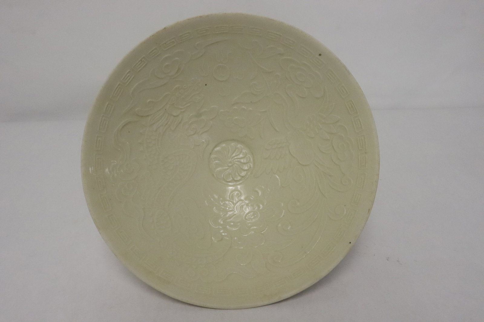 A Song style bowl: A Song style bowl embossed with dragon and phoenix motif decoration, 2.45"x8.05"dia