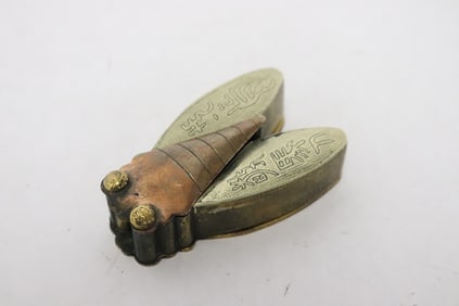 A metal box in the form of bug