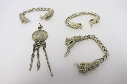 3 white metal bracelets, and a white metal pendant