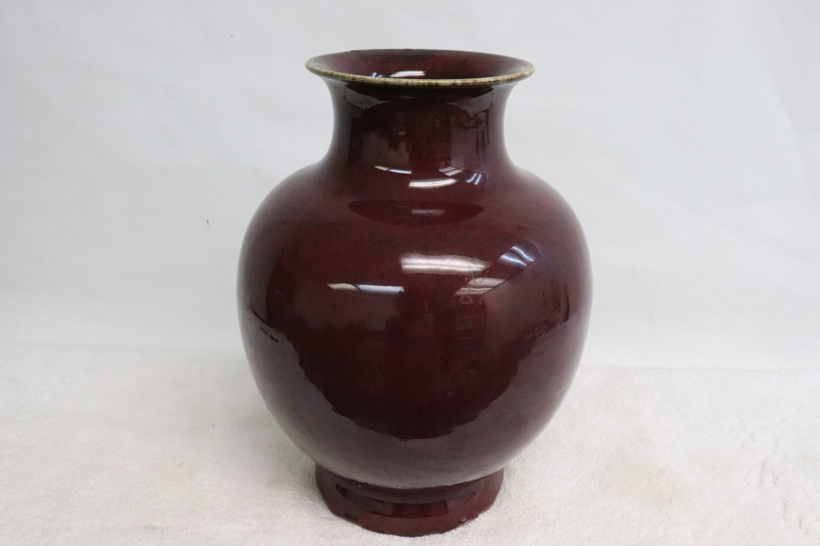 A beautiful dark red glazed porcelain jar (1 of 8)