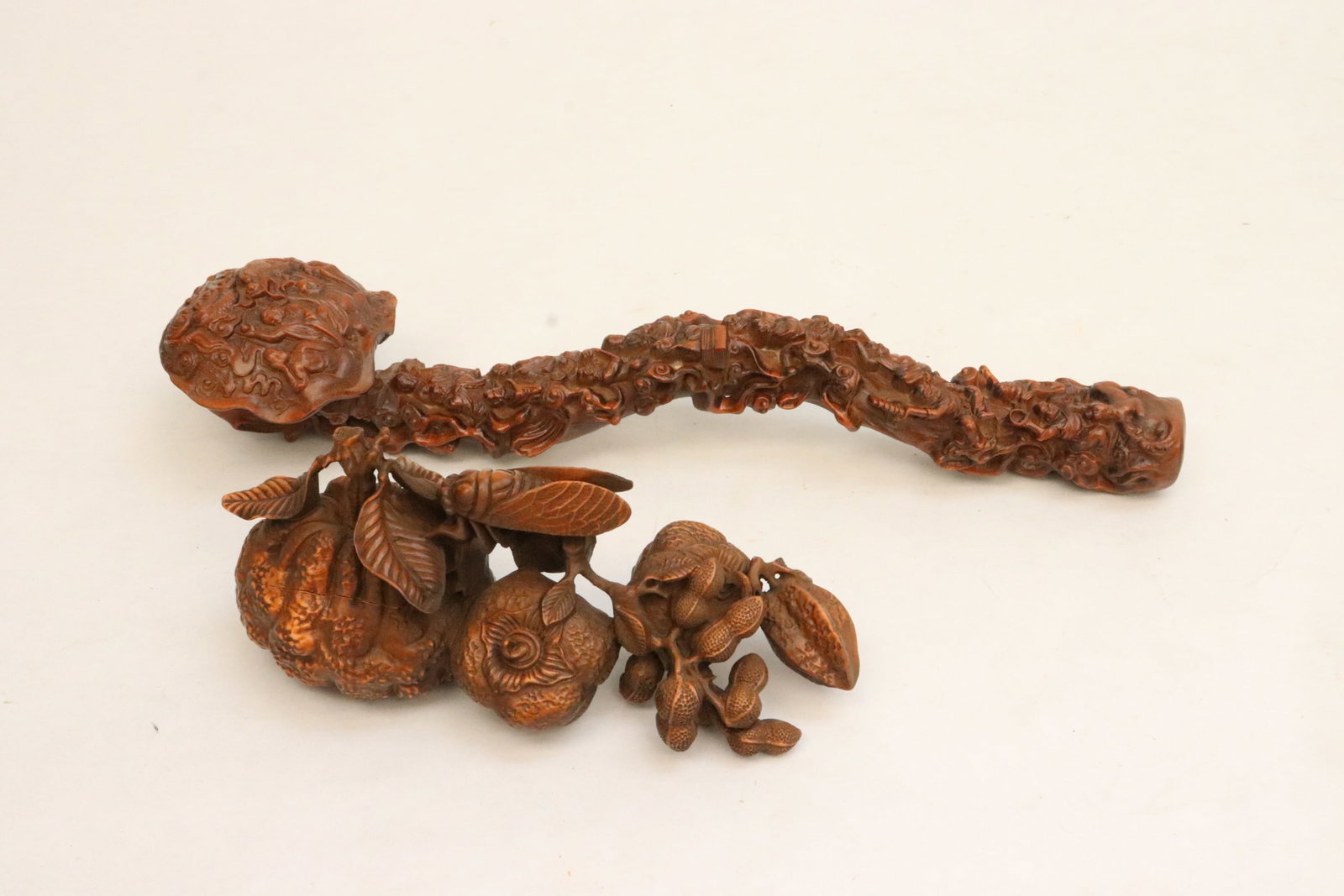 2 wood like articles; a ruyi, and a fruit branch: 2 wood like articles; a ruyi (11.9"L), and a fruit branch (6.6"L)