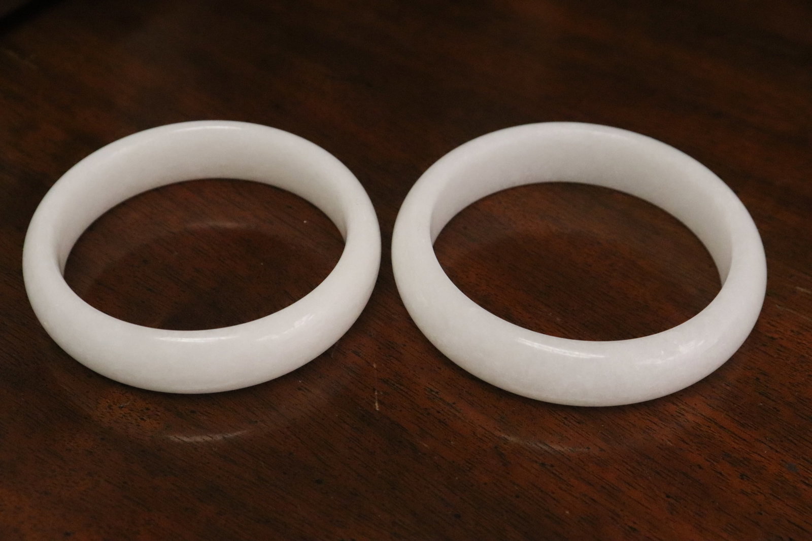 2 white stone carved bangles: 2 white stone carved bangles, 0.64"x2.9"dia, 0.645"x3.1"dia
