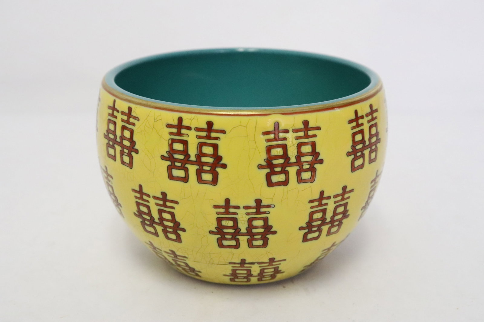 Chinese red on yellow water dripper: Chinese red on yellow water dripper decorated with double happiness symbols, 2.97"x4.45"dia