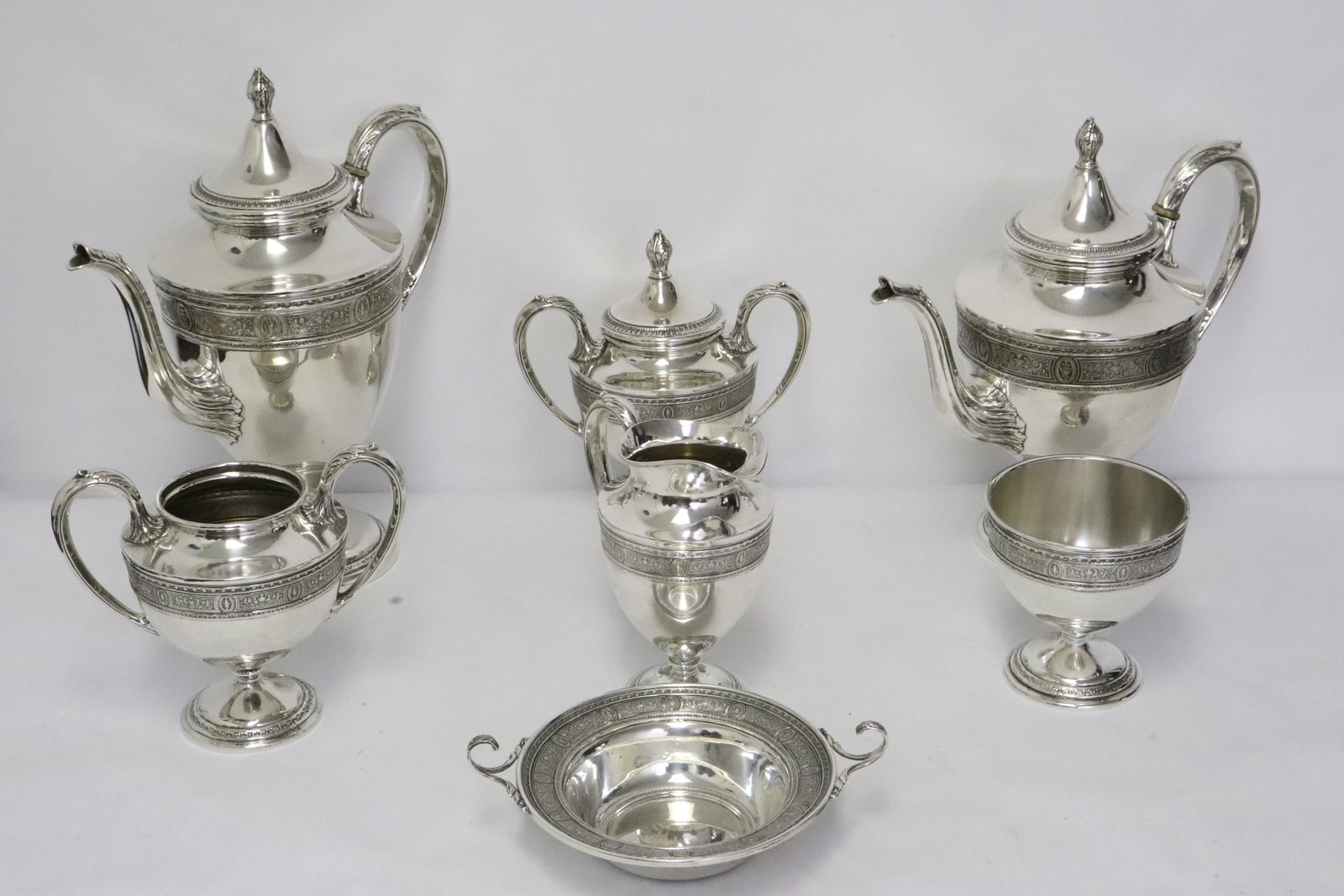 7 pieces sterling silver tea & coffee set by Int'l Silver co. in Wedgwood pattern: 7 pieces sterling silver tea and coffee set by International Silver co. in Wedgwood pattern; including teapot (10.6"11"x5.6"), coffee pot (11.97"x10.5"x5.5"), creamer (6.4"x5.3"x3.65"), 2 sugars (6.15