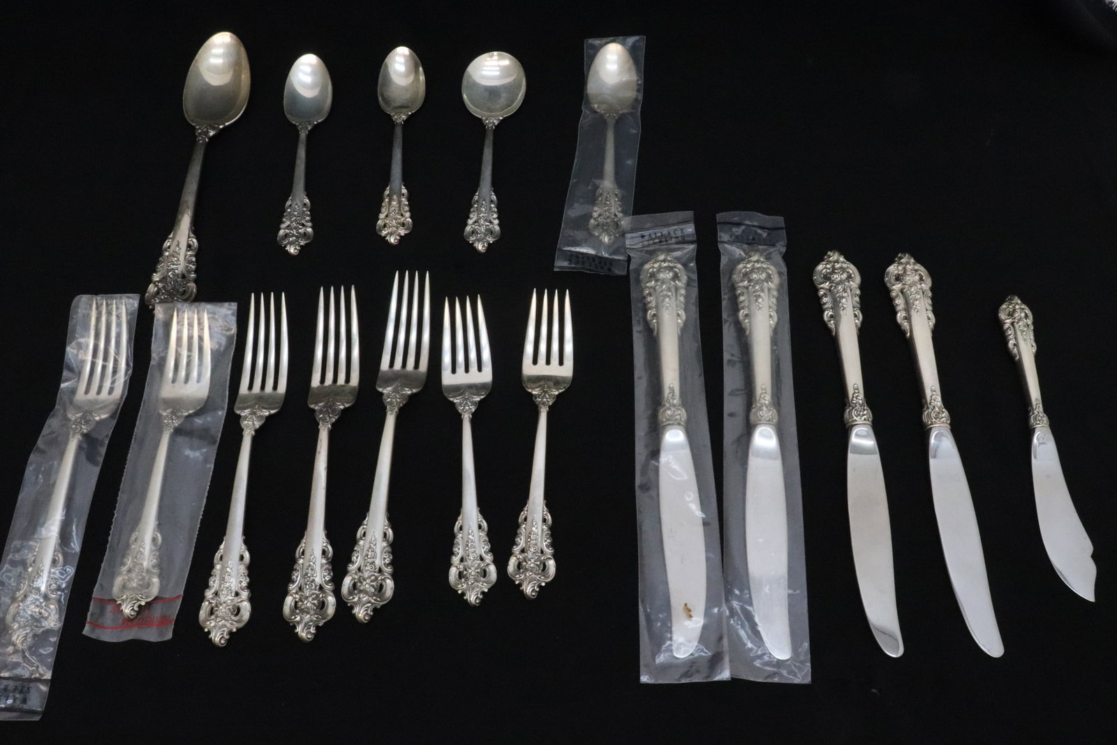 17 pieces; Wallace grand baroque sterling flatware: 17 pieces; Wallace grand baroque sterling flatware; including 4 dinner knives (8.85"L), 4 dinner forks (7.45"L), 3 salad forks (6.55"L), 3 tea spoons (6.2"L), a serving spoon (6.15"L), a butter server