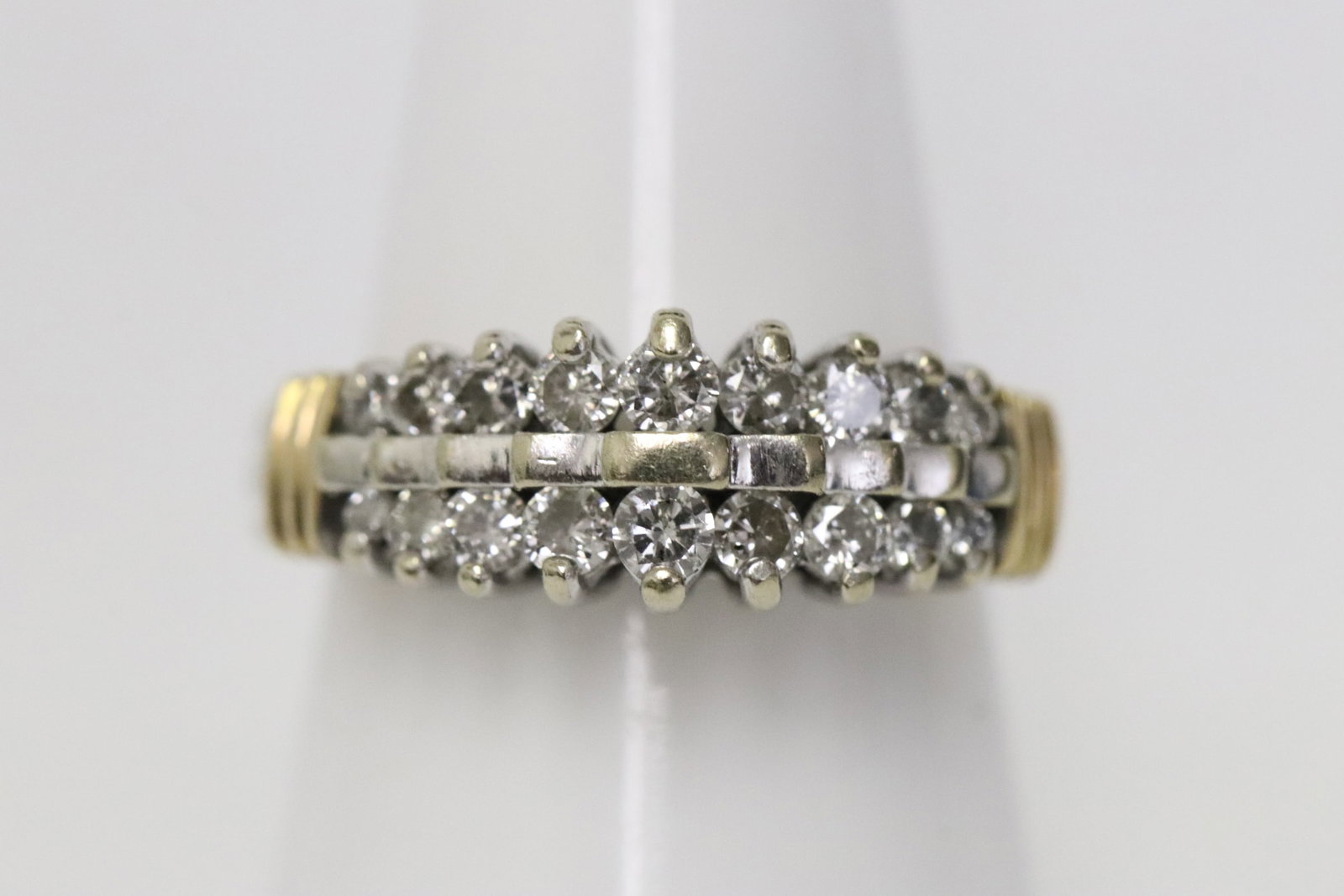 14K Y/G diamond ring: 14K Y/G diamond ring set with 18 brilliant cut diamonds, tdw approx. 0.60ct, wt. 4.3gm, size 5.5
