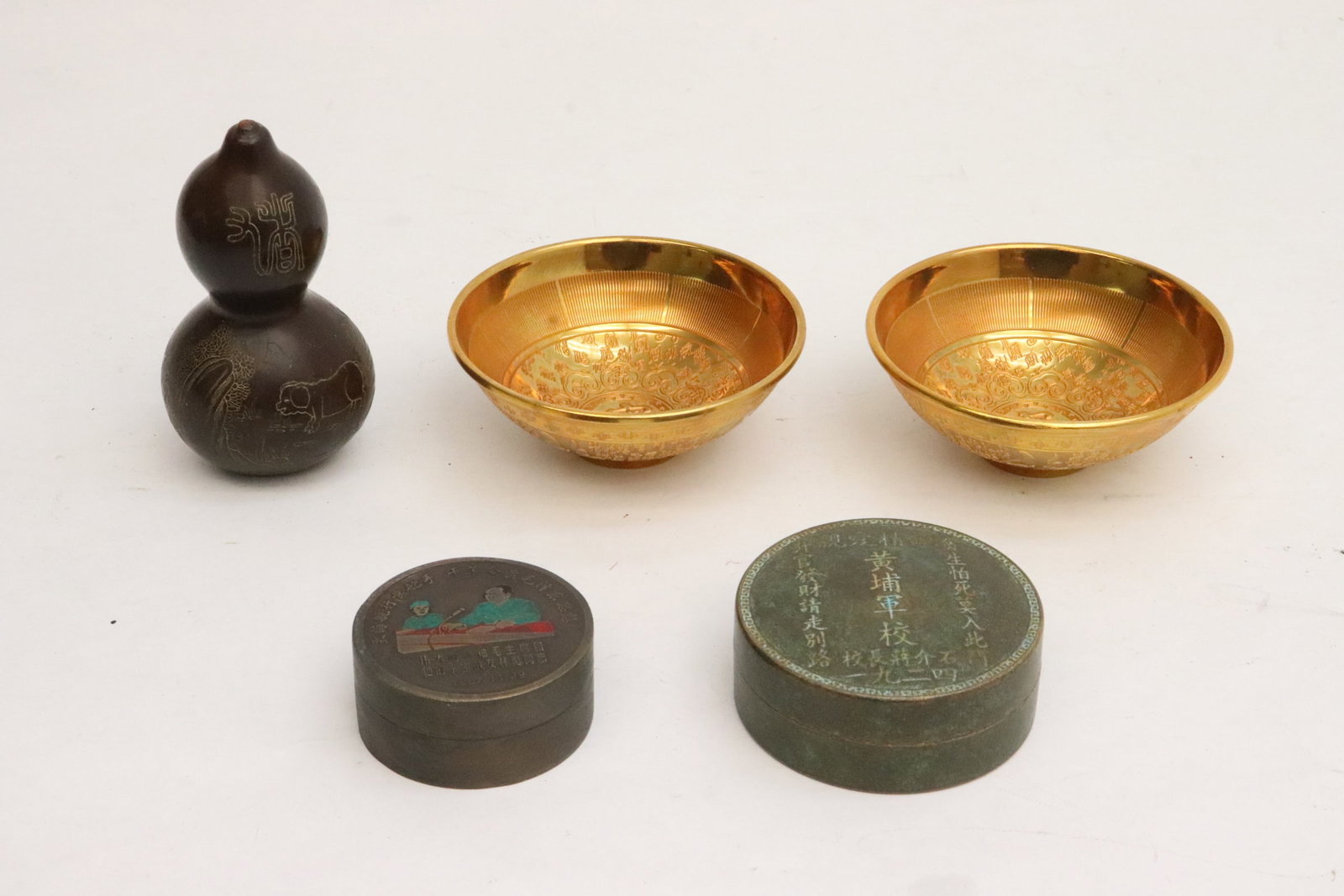 2 yellow metal bowls, 2 tin boxes, and a gourd: 5 pieces; 2 yellow metal bowls (1.6"x3.9"dia ea), 2 tin boxes (1.02"x2.25"dia, 1.3"x2.8"dia), and a gourd (4.25"x2.25"dia)