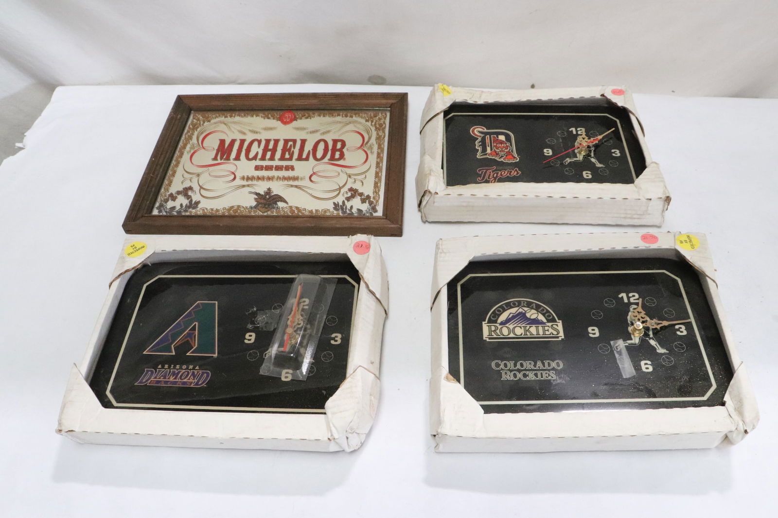 4 pieces: 4 pieces; 3 NFL football team advertising clocks (1.4"x11.5"x8.5" ea), and a Michelob small wall sign (8.65"x11.65")