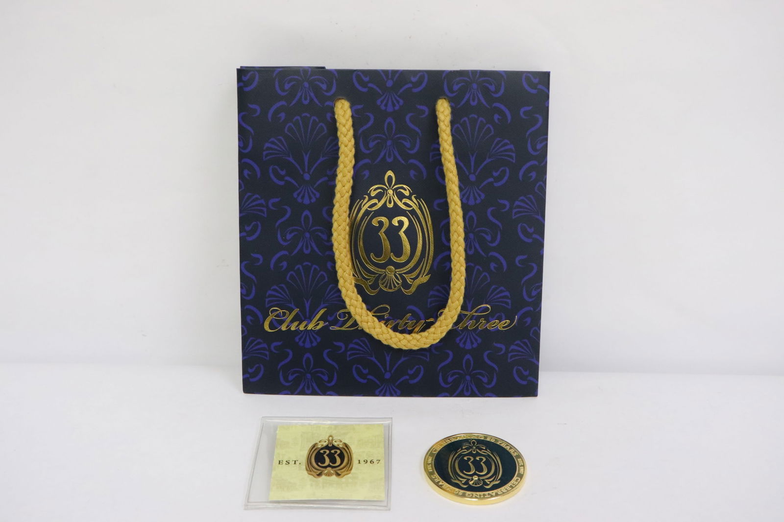 A club 33 challenge coin in original plastic sleeve (1 of 7)