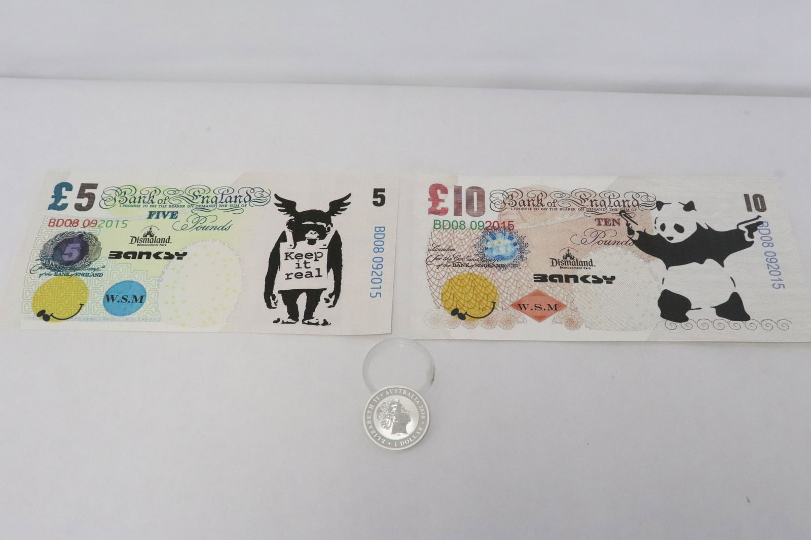 2 Banksy Dismal and funny money, & a silver coin (1 of 9)