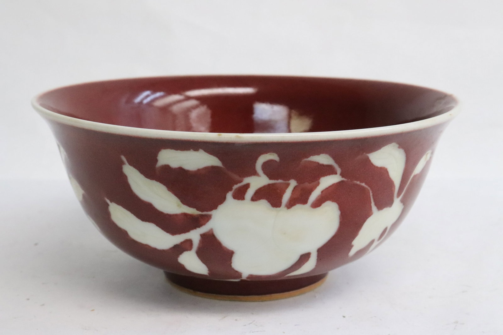 Chinese white on red porcelain bowl: Chinese white on red porcelain bowl, 2.8"x6.35"dia