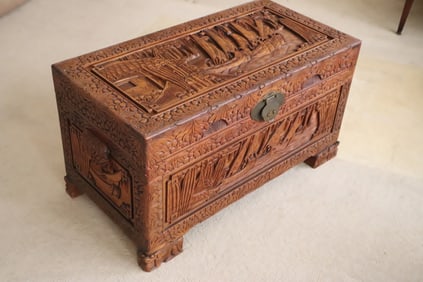 Chinese antique heavily carved camphor wood chest