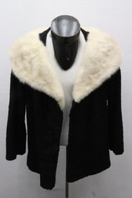 A lamb fur coat with mink collar