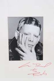 A framed Lou Reed signed photo