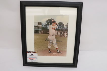 A signed photo by Warren Spahn with COA