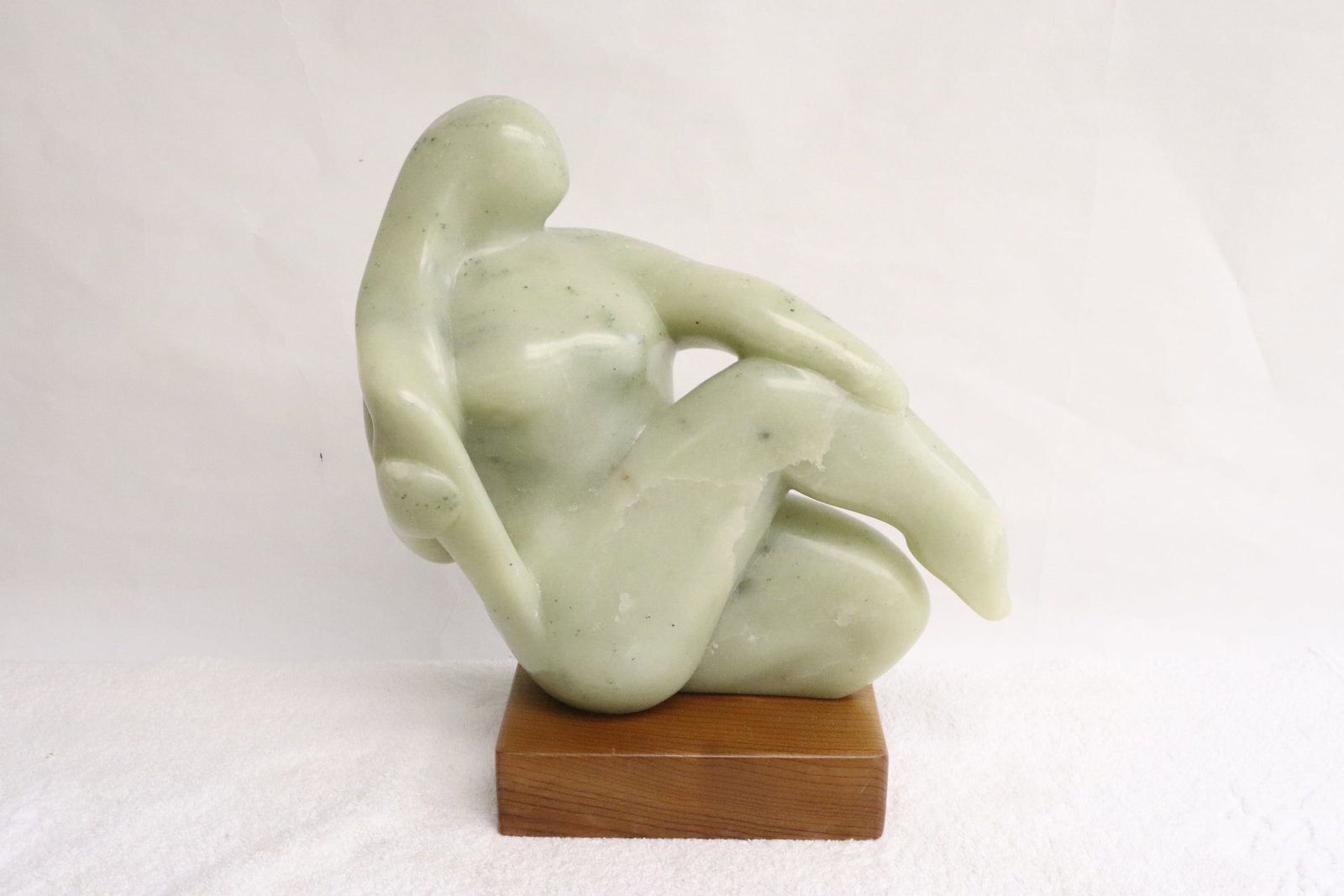 A jade like stone sculpture by Ralph N. Hurst: A jade like stone sculpture "nude" by Ralph N. Hurst (American, 1918-2003), dated 1987(?), 11.8"H