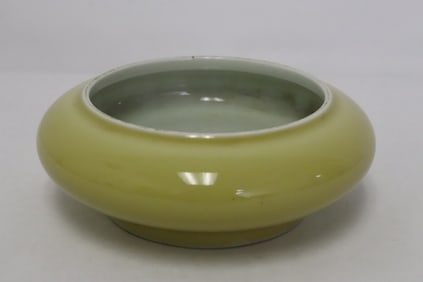 A yellow glazed porcelain brush wash